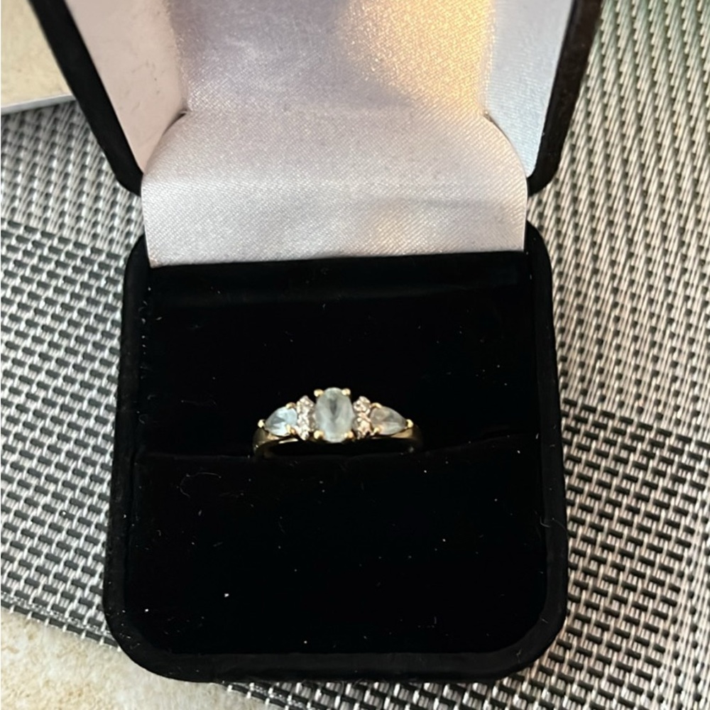 Elegant 10 karat gold aquamarine, and diamond ring